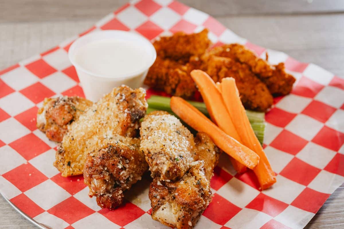 Bone-in and boneless wings with celery, carrots and ranch